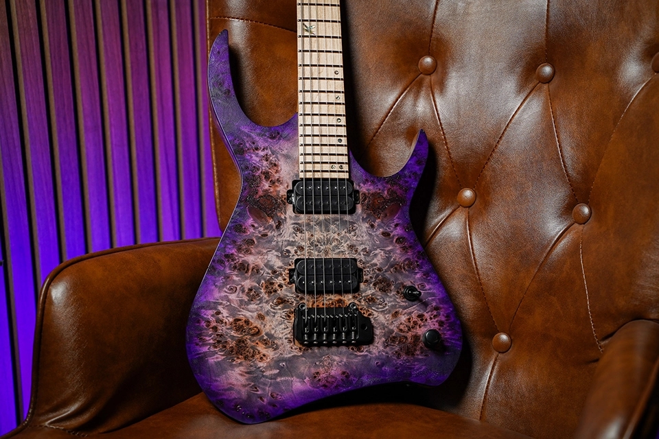 Kiesel Guitars Kyber 6 string tremolo with poplar burl top, purple california burst finish, black hardware, birdseye maple fingerboard, and abalone ring inlays K logo 12th fret