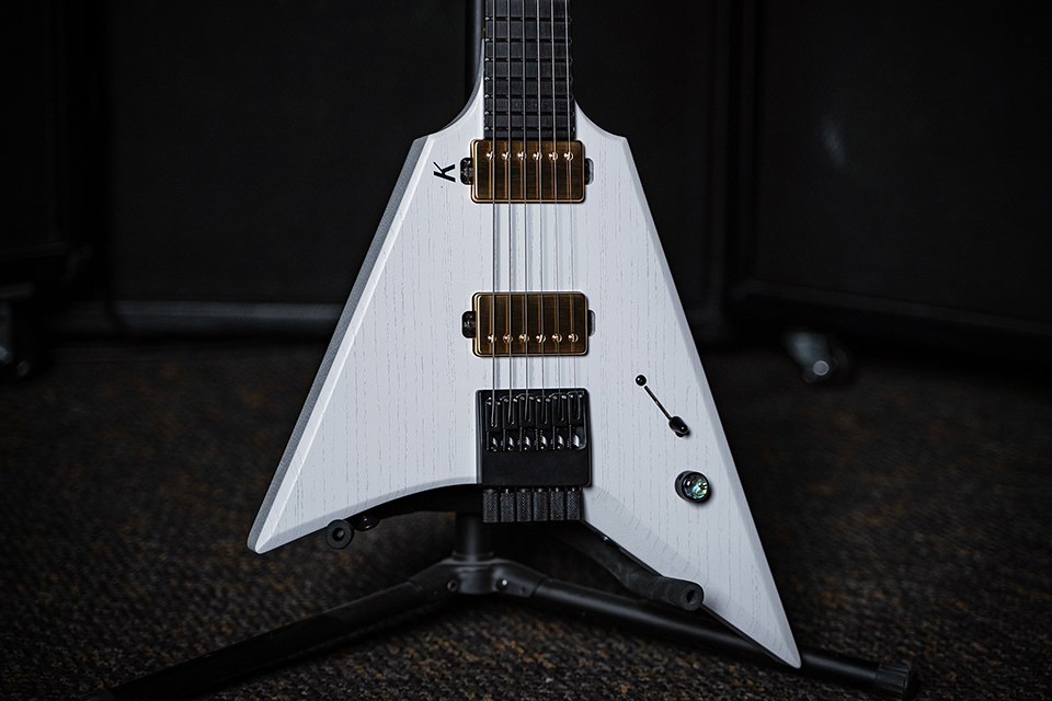 Kiesel Guitars Type-V TV6 with white/white finish, raw tone top coat, gold pickup covers, gold pole pieces, richlite diamond black fingerboard, no top inlays NIN, black K logo, abalone inlay knob