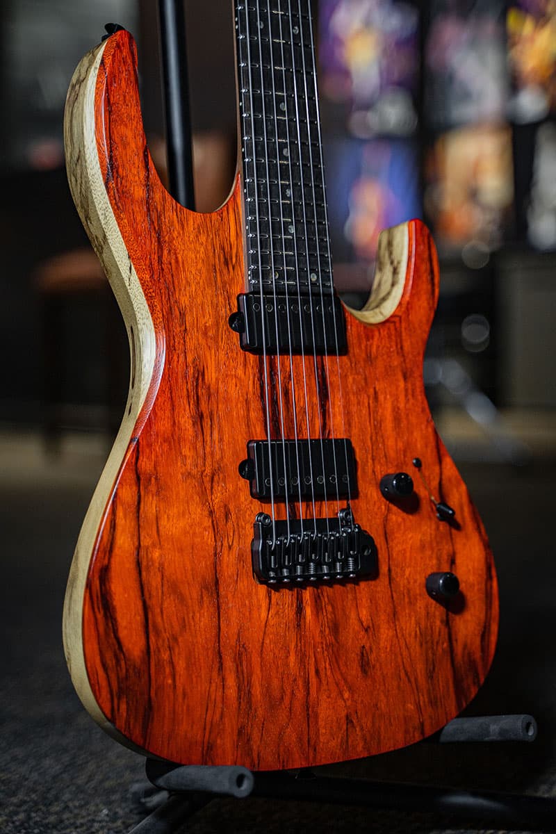 Kiesel Guitars DC DC700X tremolo with black limba body, black limba top, translucent orange finish, black hardware, ebony fingerboard, mother of pearl dot inlays, rear body natural clear RNC