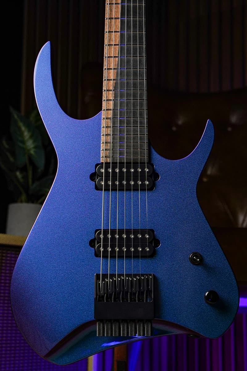 Kiesel Guitars Kyber Headless 7 string with royal ebony fingerboard, blue to purple color shift finish, no top inlays, and black hardware