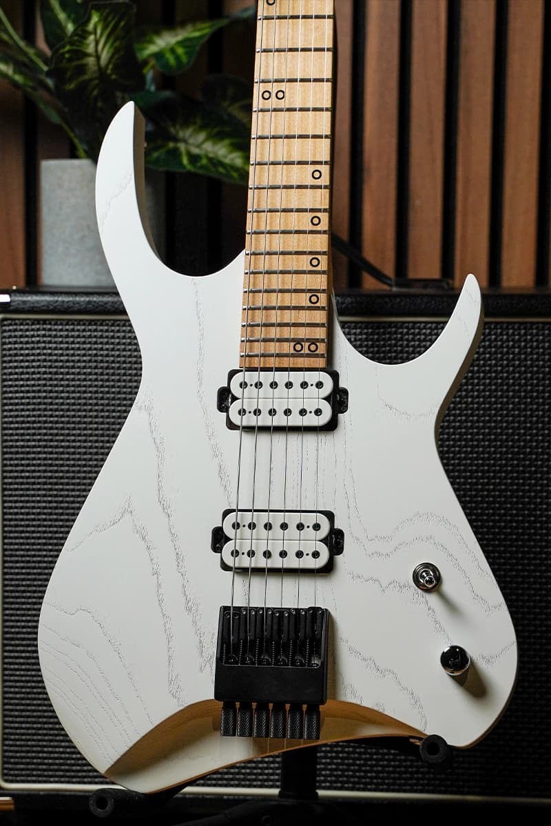 Kiesel Guitars Kyber Headless 6 string with swamp ash body, white/white raw tone finish, and white pickup bobbins