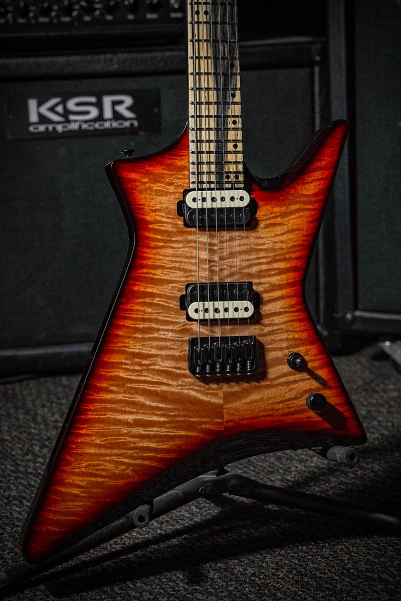 Kiesel Guitars Hyperdrive H7H 7 string with palemoon ebony fingerboard, orange burst finish, flamed maple top, black back and sides BGB, black and cream pickup coils, black acrlic staggered offset dot inlays, black hardware