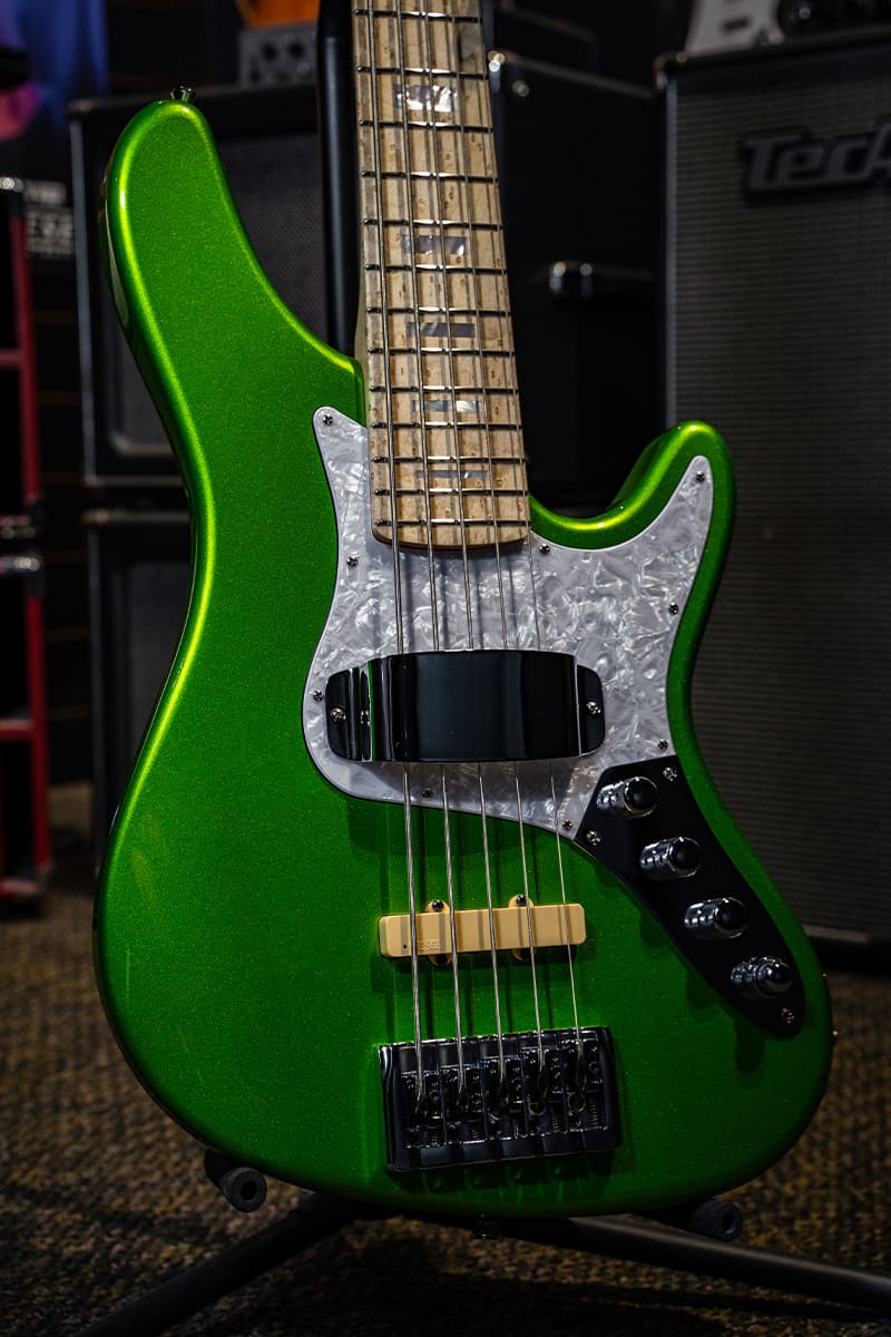 Kiesel Guitars J-Bass 5 String With emerald green finish, metal flake finish, sparkle finish, white pearloid pickguard, chrome hardware, handguard, abalone block inlays, birdseye maple fingerboard, cream JVA pickups