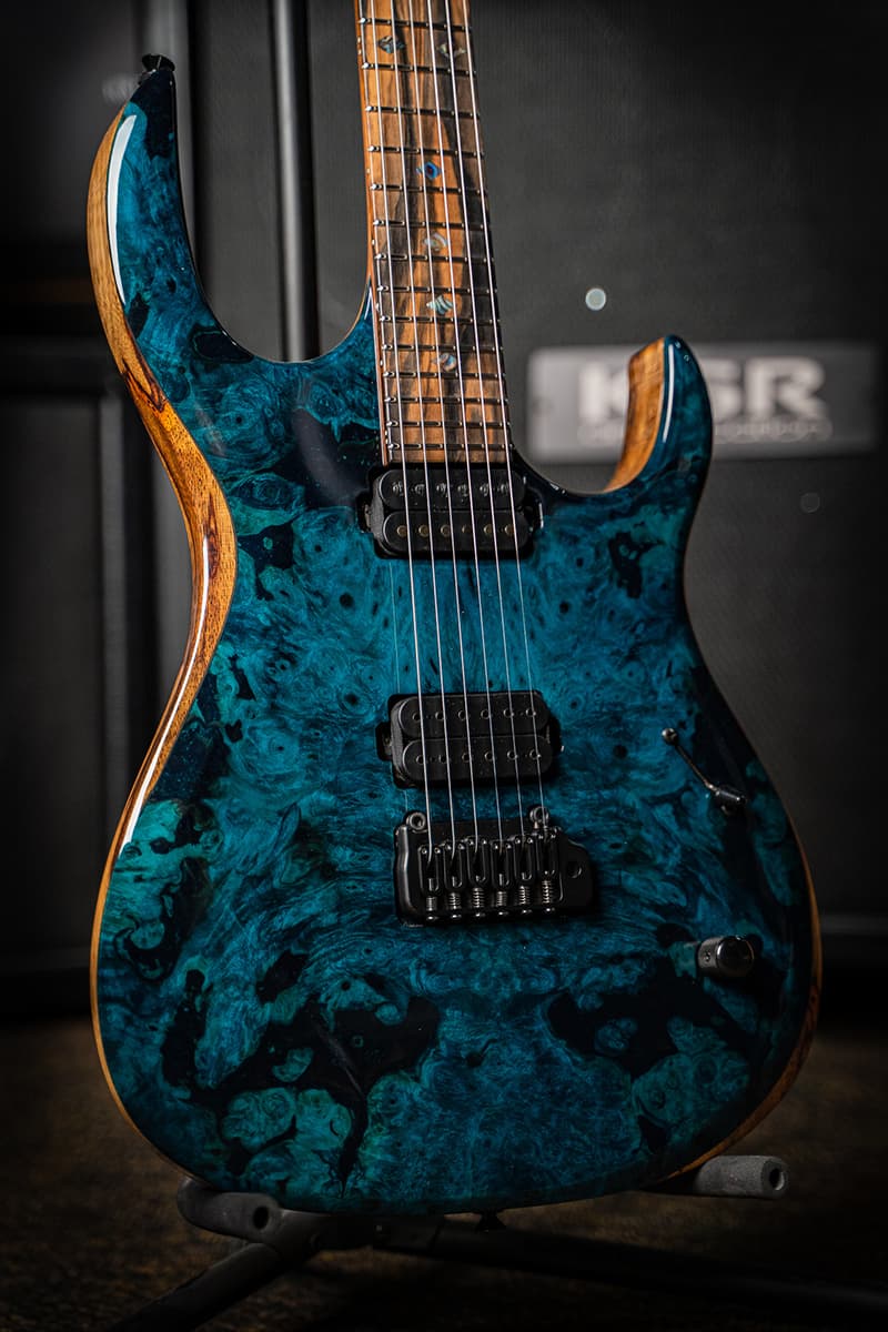 Kiesel Guitars K-Series tremolo K6X with aqua finish, master grade buckeye burl top, rear natural clear RNC, master grade koa body, royal ebony fingerboard, mother of pearl diamond inlays