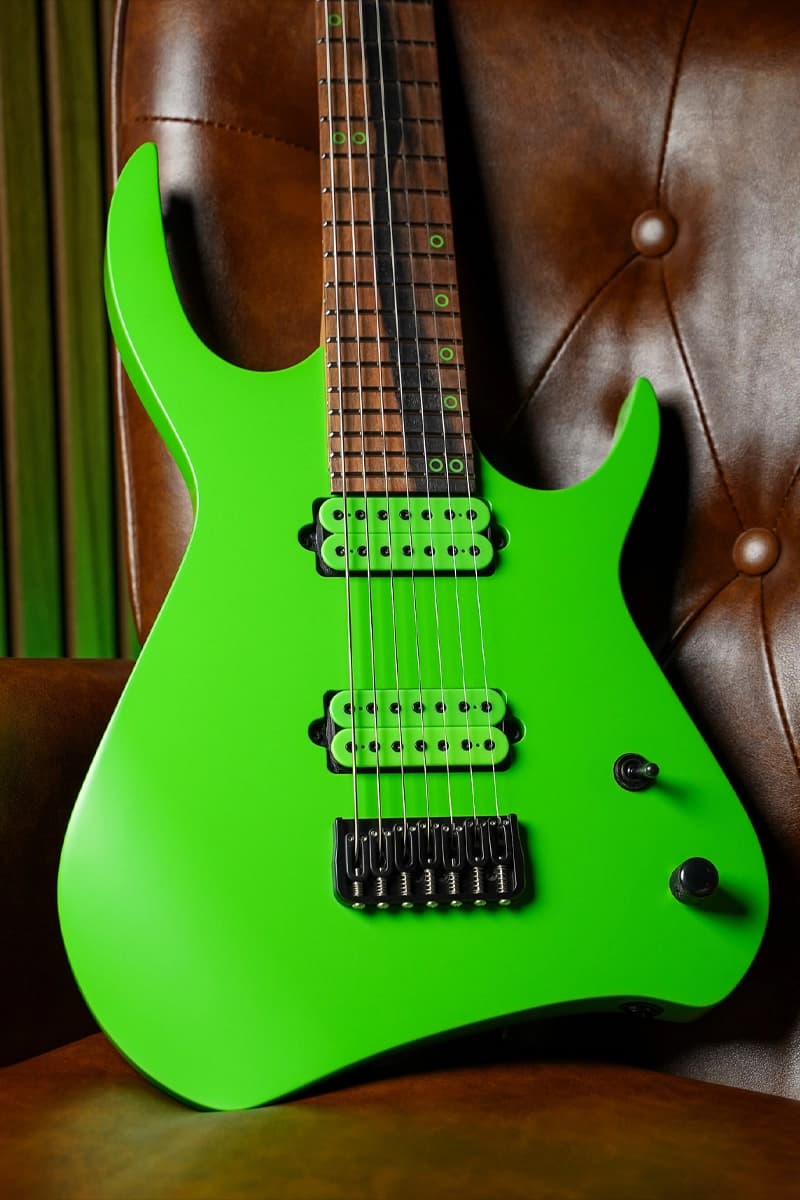 Kiesel Guitars Kyber 7 string with kiesel racing green finish, royal ebony fingerboard, kiesel racing green pickup bobbins, krg staggered offset ring inlays, black hardware