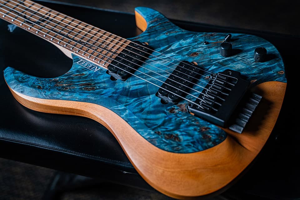 Kiesel Guitars Osiris O7X alder body, rear natural clear back and sides RNC, select aurora blue stain, poplar top, black hardware, royal ebony fingerboard, black pickup poles