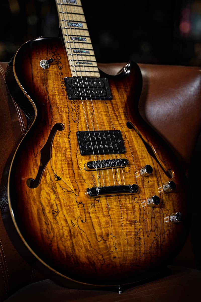 Kiesel Guitars SH550 with spalted maple top, vintage burst finish, maple fingerboard, abalone block inlays, black pickup coils, black bezels, chrome hardware, natural top wood binding BBE, black burst edges