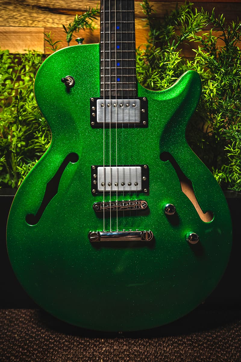 Kiesel Guitars SH550 with chrome pickup covers, green sparkle (metal flake) finish, black bezels, blue acrylic dot inlays, ebony (less color variation) fingerboard, chrome hardware