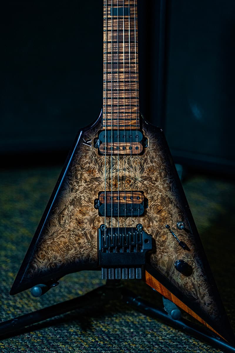 Kiesel Guitars Type-V TV6X tremolo with master grade burled maple top, black burst edges, baked kiesel treated fingerboard, flamed maple fingerboard, wooden pickup bobbins, abalone inlay knobs, black hardware