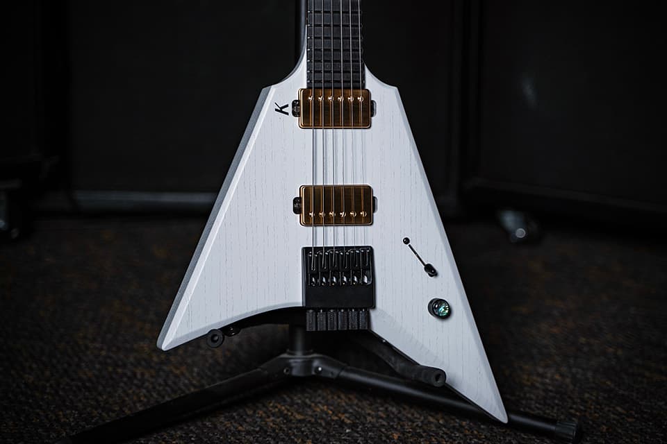 Kiesel Guitars Type-V TV6 with white/white finish, raw tone top coat, gold pickup covers, gold pole pieces, richlite diamond black fingerboard, no top inlays NIN, black K logo, abalone inlay knob