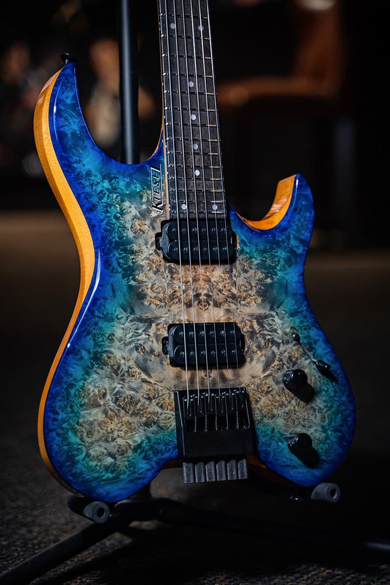 Kiesel Guitars Vader V6 with poplar top, california aqua burst finish, alder body, black hardware, ebony fingerboard, mother of pearl dot inlays, black drop shadow logo, black pickup poles