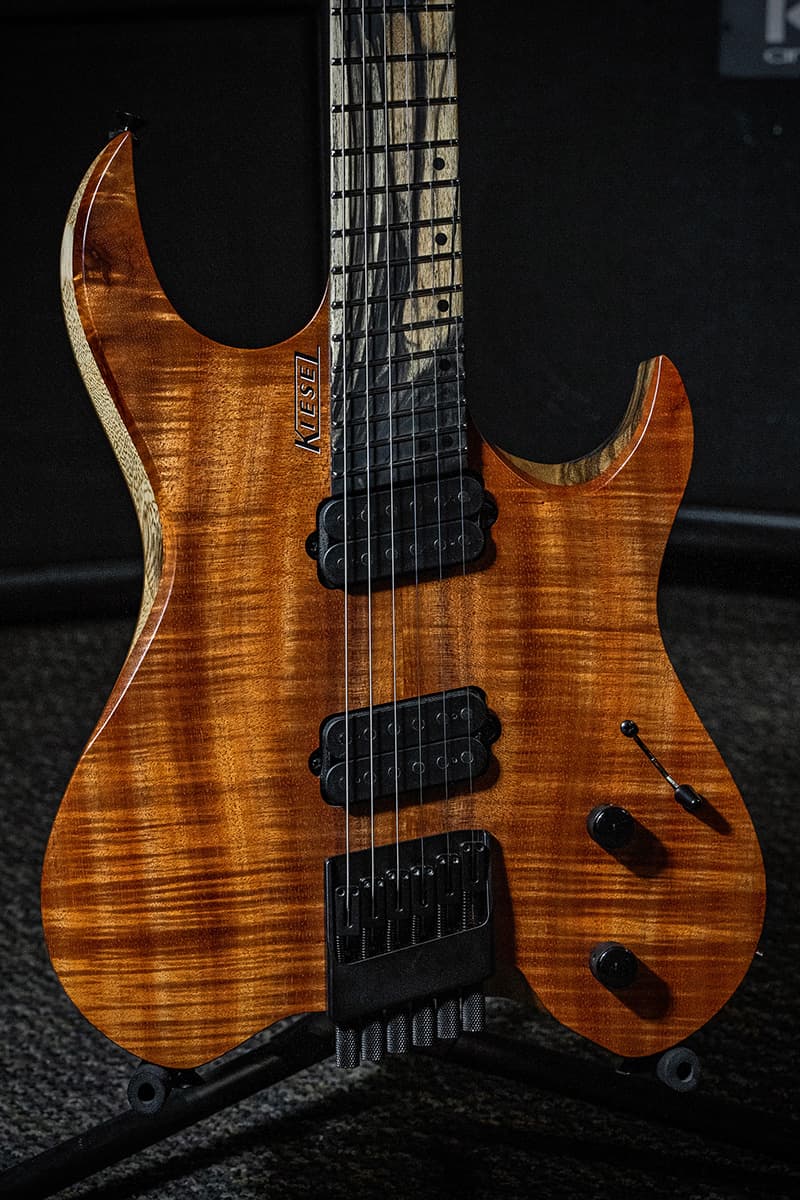 Kiesel Guitars Vader Multiscale VM6 with flamed koa top, black limba body, rear natural clear back and sides RNC, palemoon ebony fingerboard, black pickup poles, black hardware, black drop shadow logo