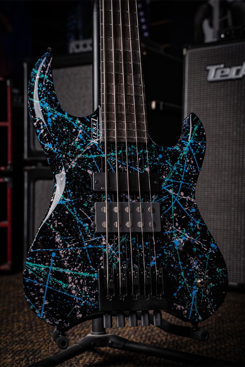 Kiesel Guitars Vader Bass 5 String With jet black finish, teal blue and white splatter finish, HB2 in sweet spot bridge pickup, kiesel radius neck pickup, ebony (less color variation) fingerboard, no top inlays NIN, white logo