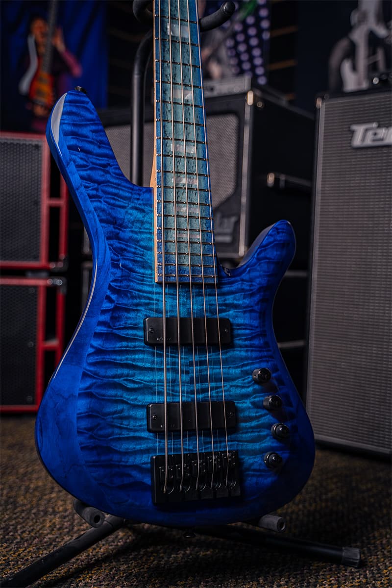 Kiesel Guitars Vanquish Bass 5 String With quilted maple top, translucent aqua burst finish, aqua burst kiesel treated fingerboard, mother of pearl block inlays, black hardware, swamp ash body