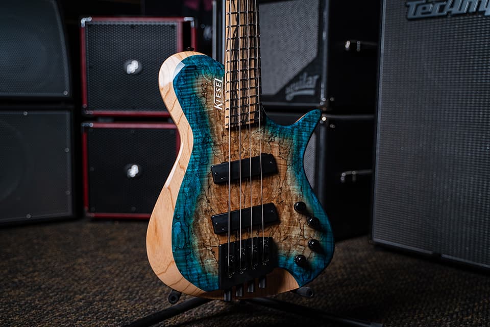/Kiesel Guitars Zeus Bass 4 String Multiscale with aqua burst finish, california burst, palemoon ebony fingerboard, swamp ash body, rear of body natural clear RNC, white logo, no top inlays NIN, black hardware, spalted maple top