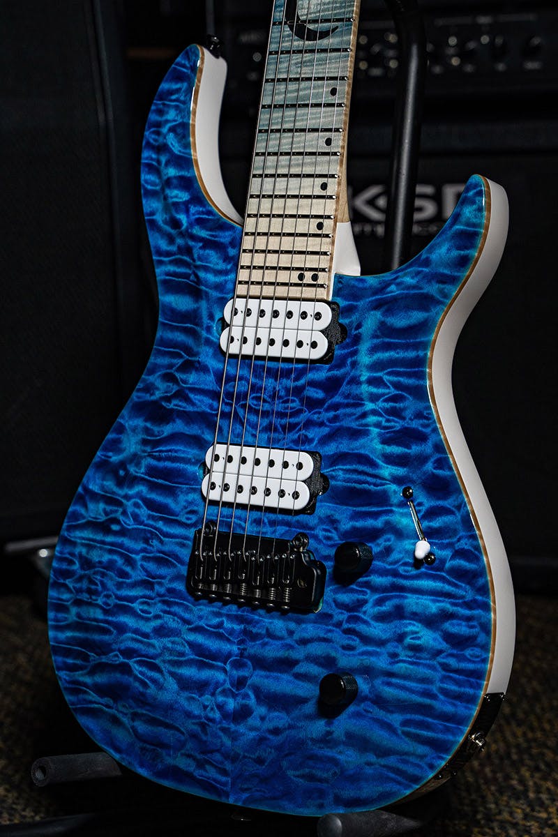 Kiesel Guitars Crescent tremolo C6X with quilted maple top, translucent blue finish, white back and sides WGB, white pickup coils, black to natural kiesel treated fingerboard, flamed maple fingerboard, black acrylic crescent moon with staggered offset dot inlays