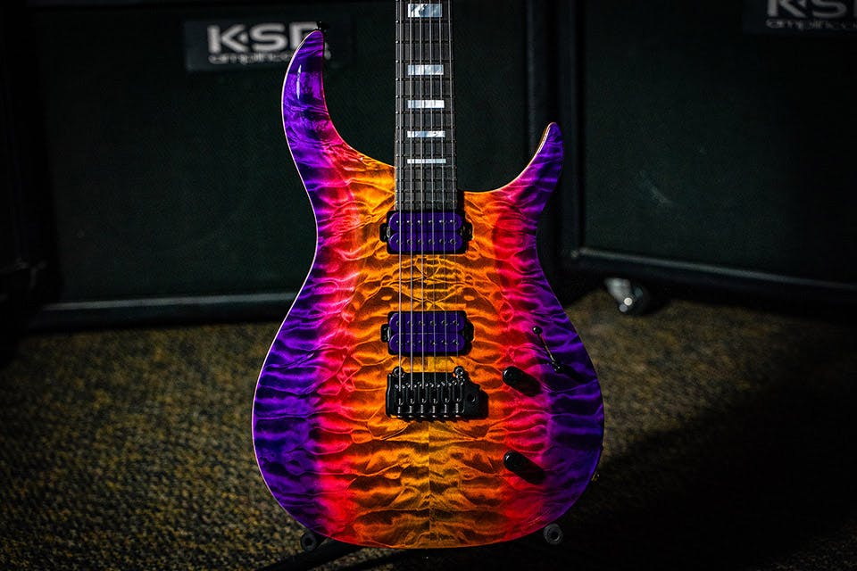 Kiesel Guitars Crescent tremolo C6X with quilted maple top, custom multi-color vertical fade, purple pickup coils, black hardware, mother of pearl block inlays, ebony fingerboard