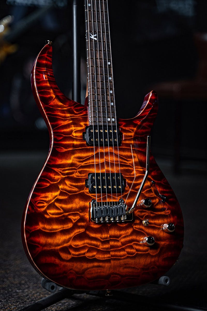 Kiesel Guitars Crescent tremolo C6X with quilted maple top, orange burst finish, chrome hardware, ebony fingerboard, mother of pearl 12th fret k logo with staggered offset dot inlays IKSD, gold pole pieces, natural top wood binding, rear matches top finish RMT