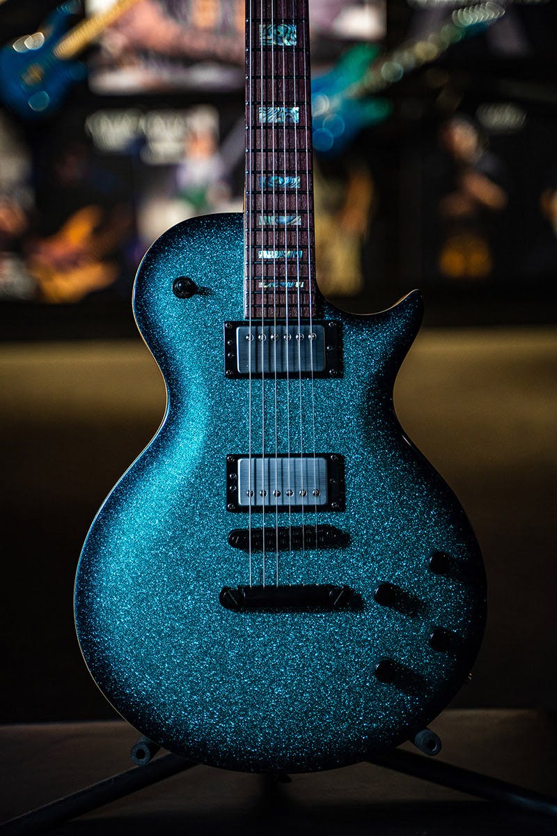 Kiesel Guitars CS3M with aqua metal flake (sparkle) finish, abalone block inlays, ebony fingerobard, chrome pickup covers, black bezel, black hardware