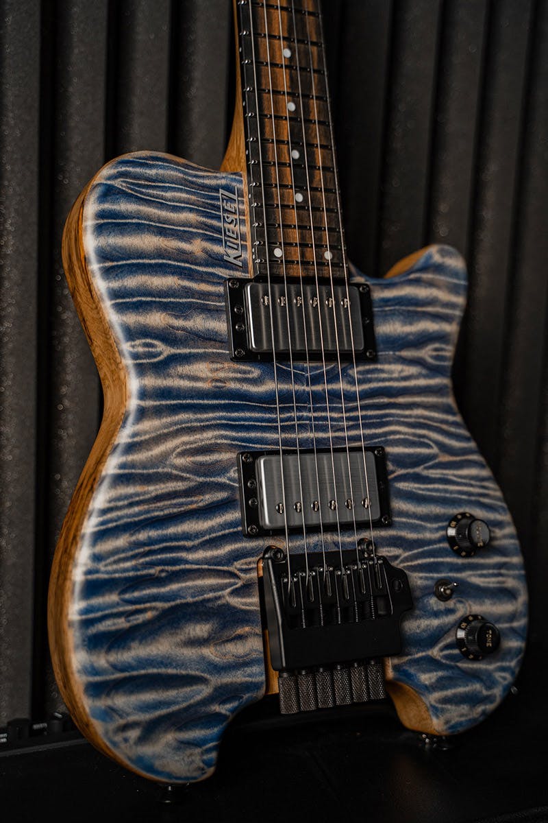 Kiesel Guitars Allan Holdsworth Signature HH2X with tremolo, blue denim finish, quilted maple top, rear of body natural clear, black limba body, chrome pickup covers, royal ebony fingerboard, white acrylic dot inlays, satin finish