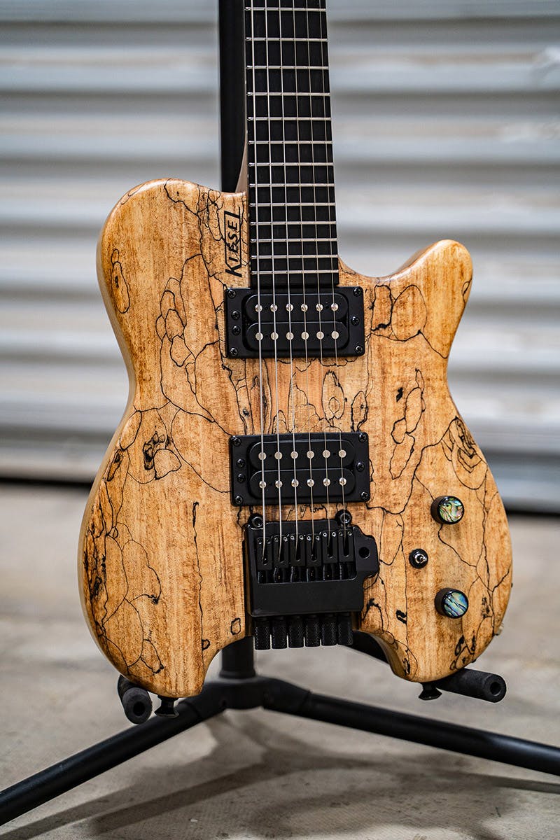 Kiesel Guitars Allan Holdsworth Signature HH2X with tremolo, spalted maple top, swamp ash body, black hardware, abalone inlay knobs, ebony (less color variation) fingerboard, no top inlays NIN, black logo