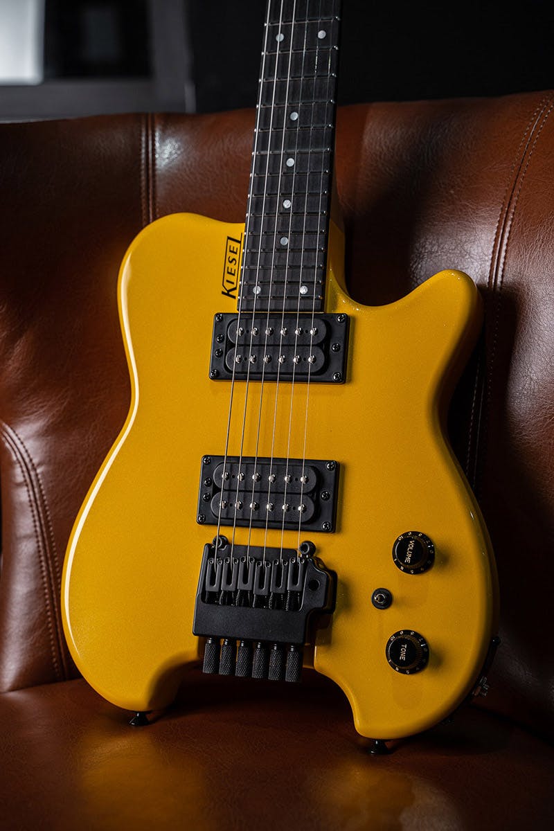 Kiesel Guitars Allan Holdsworth Signature HH2X with tremolo, mclaren yellow finish, gloss top coat, black hardware, ebony (less color variation) fingerboard, black logo, mother of pearl dot inlays, black plastic knobs