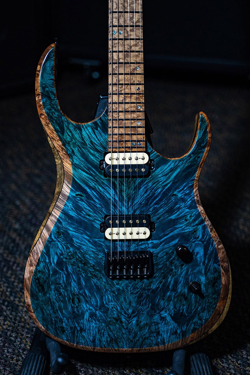 Kiesel Guitars K-Series K6H with master grade burled maple top, aqua finish, deep natural top wood binding DBBEB, black limba body, black and white pickup coils, roasted birdseye fingerboard, abalone 12th fret K logo staggered offset dot inlays