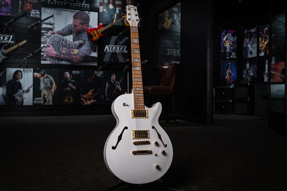 Kiesel Guitars SH550 with white/white finish, gold pickup covers, gold hardware, gold pole pieces, roasted maple fingerboard, mother of pearl block inlays, cream bezels, cream truss rod cover, gold logo, midi option SH575