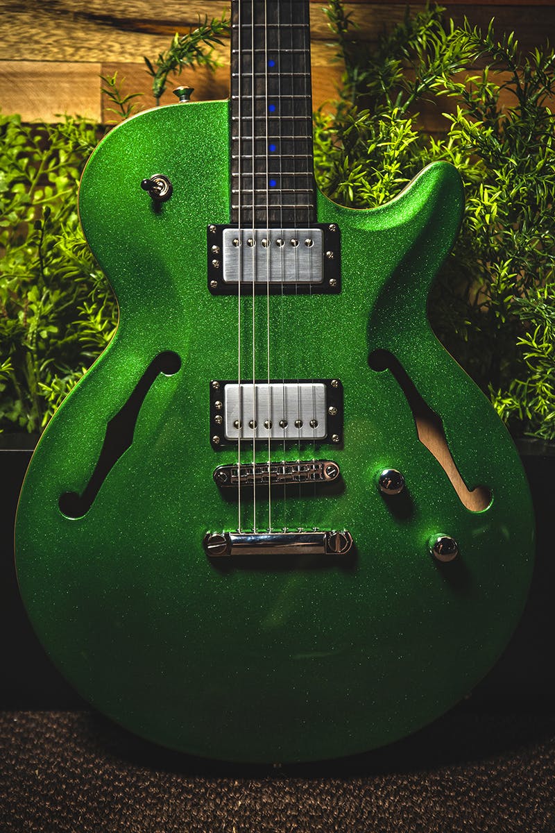 Kiesel Guitars SH550 with chrome pickup covers, green sparkle (metal flake) finish, black bezels, blue acrylic dot inlays, ebony (less color variation) fingerboard, chrome hardware