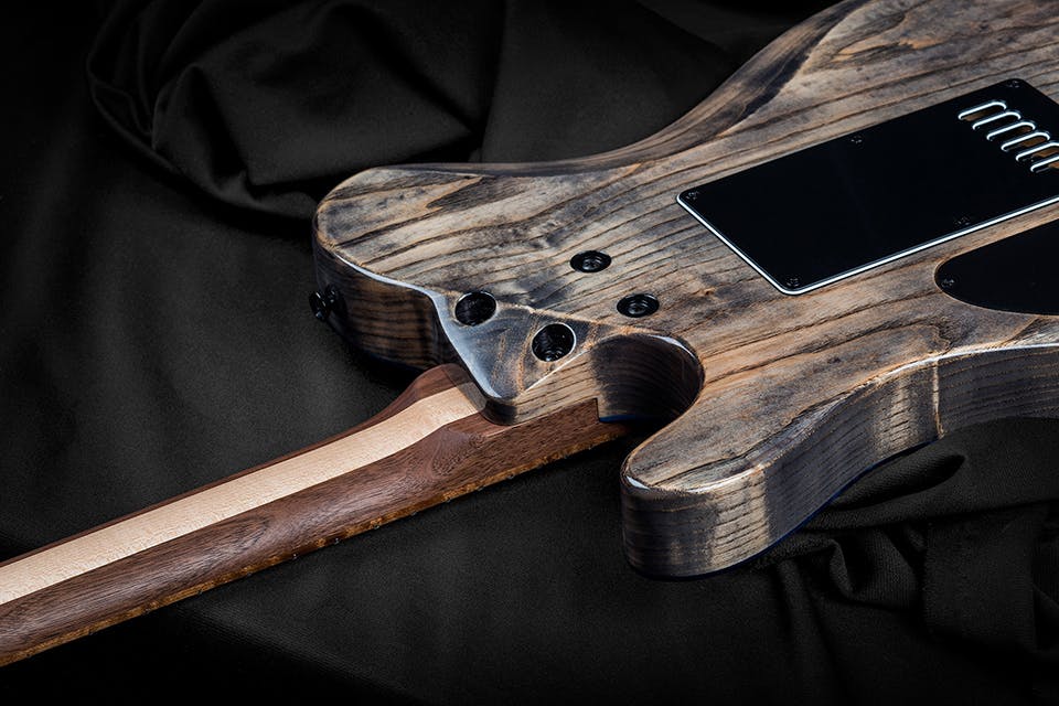 Kiesel Guitars Solo tremolo S6X neck heel with swamp ash body, antique ash treatment, 3 piece walnut neck with maple stripe, black hardware