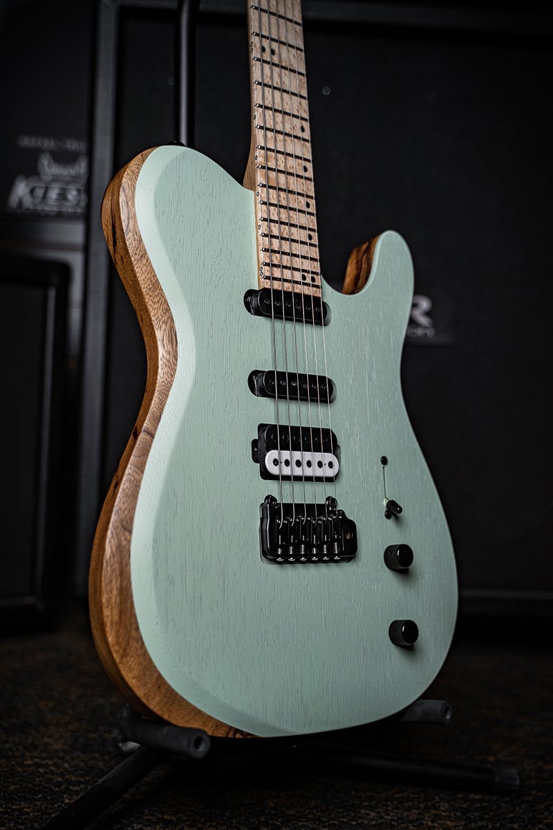 Kiesel Guitars Solo tremolo S6X with black limba body, rear natural clear RNC, swamp ash top, seafoam green finish, raw tone top coat, black and white pickup coils, humbucker-single-single HSS, black hardware, maple fingerboard, black acrylic staggered offset dot inlays