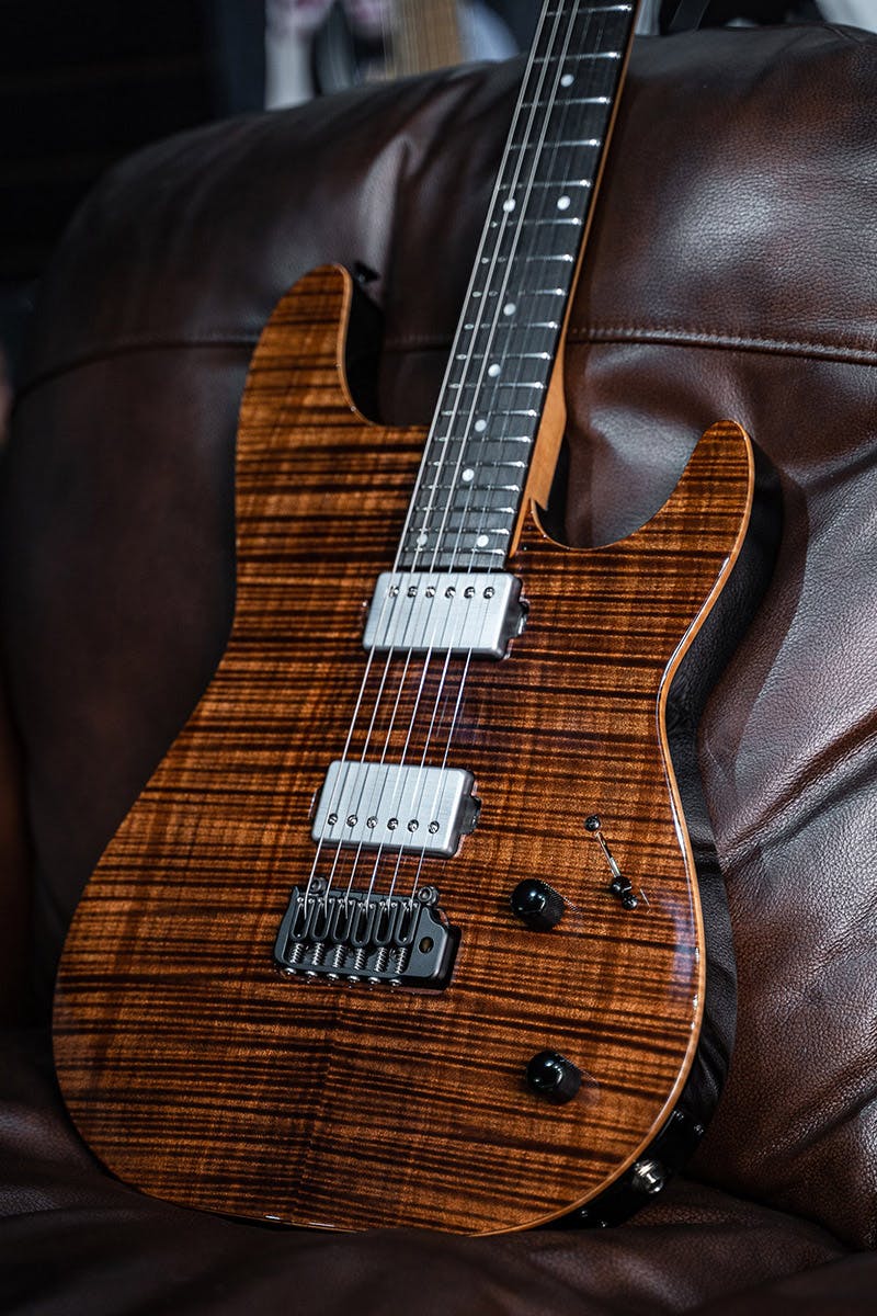 Kiesel Guitars Theos T6X with flamed maple top, antique brown finish, chrome pickup covers, black hardware, ebony less color variation fingerboard, black back and sides BGB