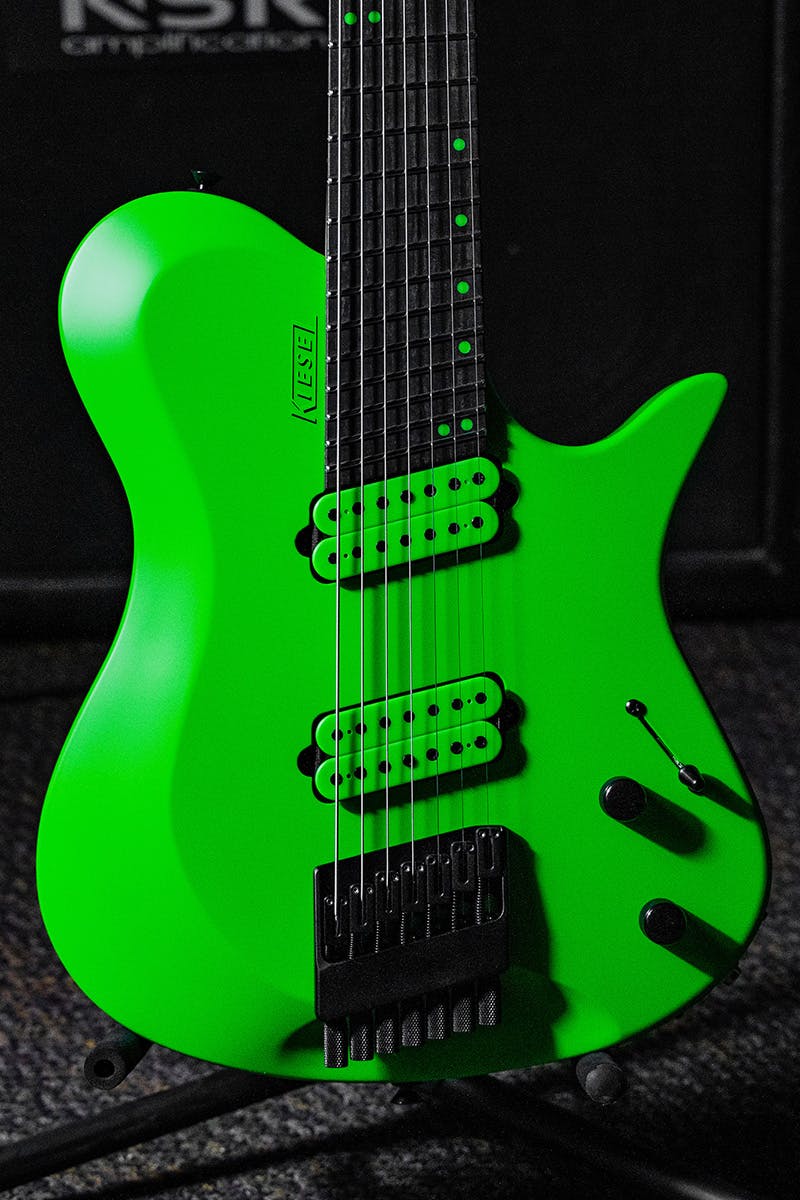 Kiesel Guitars Zeus 7 string multiscale ZM7 with kiesel racing green finish, kiesel racing green pickup coils, black hardware, kiesel racing green logo, ebony less color variation fingerboard, kiesel racing green staggered offset dot inlays