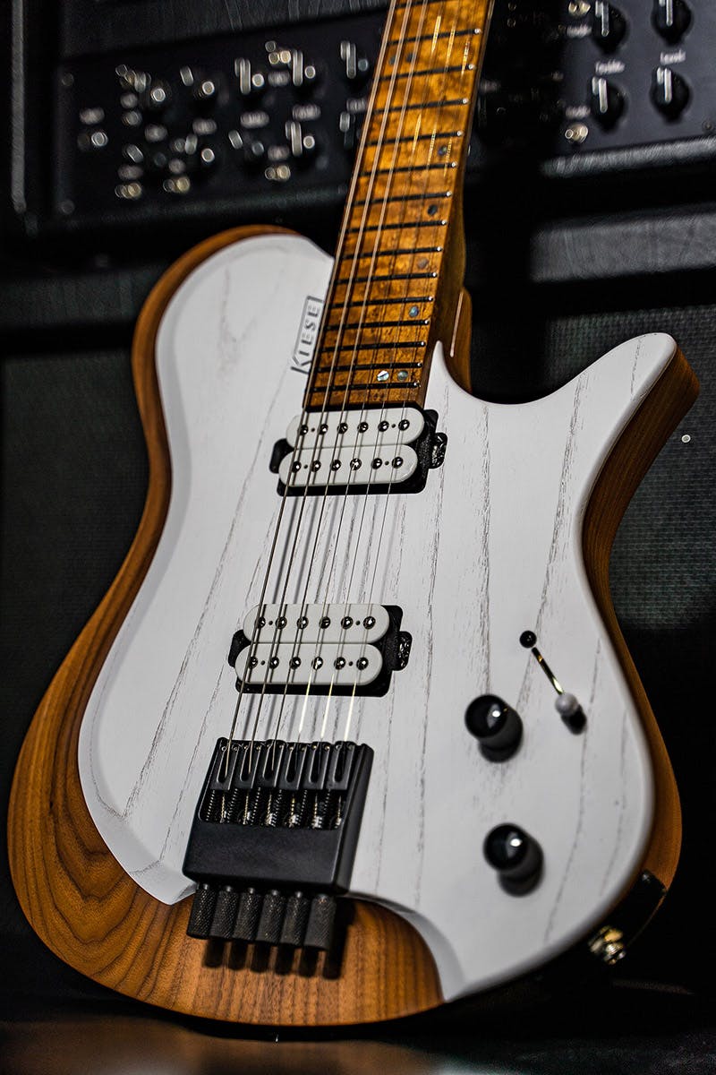 Kiesel Guitars Zeus Z6 with walnut body, white/white finish, raw tone top coat, black logo, swamp ash top, white pickup coils, black hardware, roasted maple fingerboard