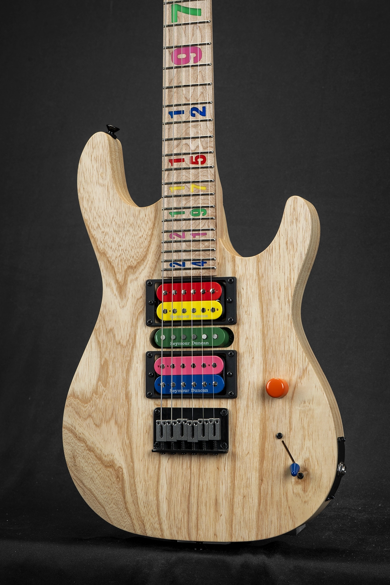 Multi-colored numbered inlays on maple fingerboard