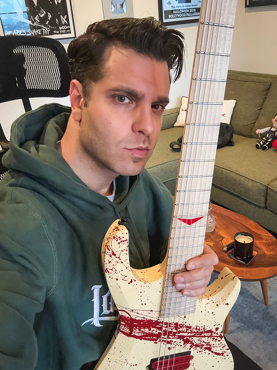 Spencer Charnas of Ice Nine Kills with his special edition Voorhees guitar